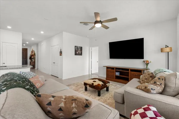 a living room with furniture fireplace and a flat screen tv