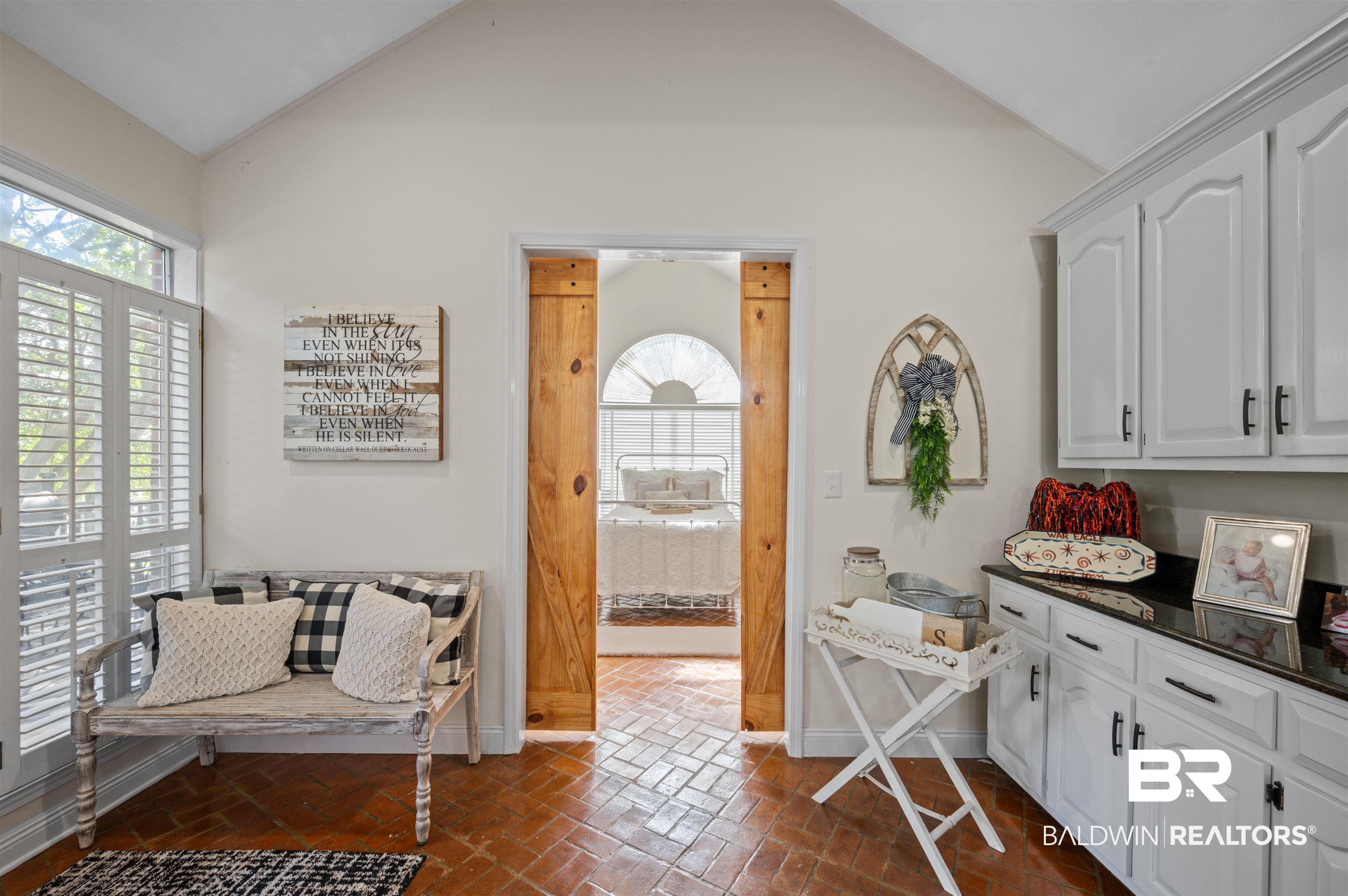 141 Blue Ridge Drive Monroeville, AL 36460 - Photo 12 of 40 Interior space featuring brick floors and high vaulted ceiling
