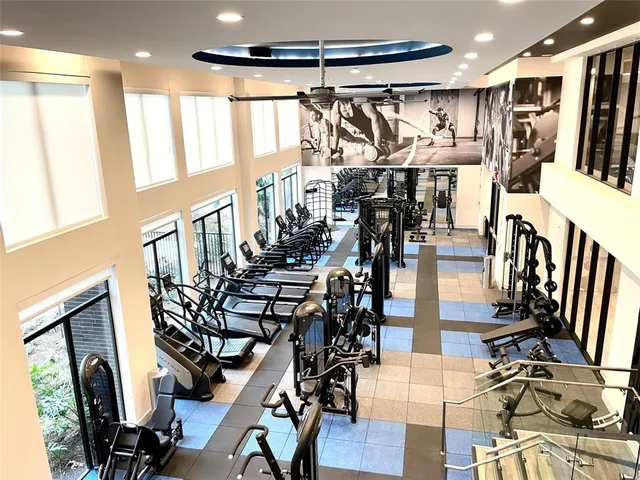 a lobby with furniture and floor to ceiling window