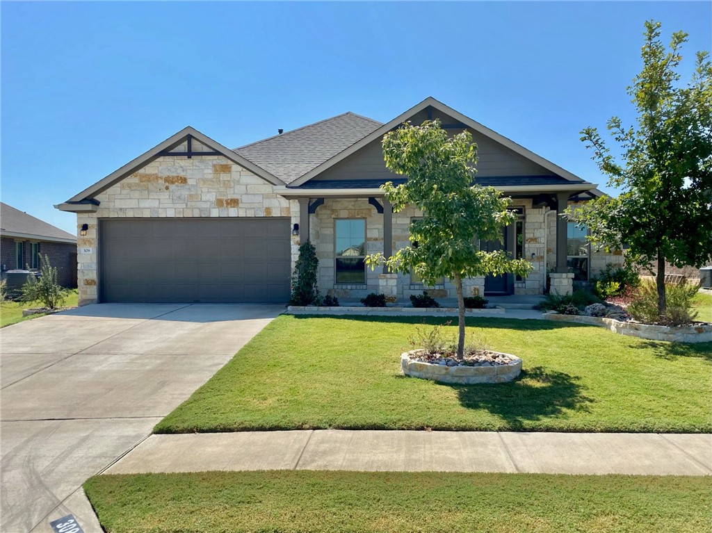 308 Chalk Knob Manor Leander, TX 78641 - Photo 1 of 1 a front view of a house with a yard