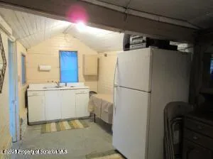 a utility room with cabinets washer and dryer