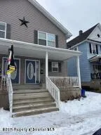 a view of a house with a iron gate
