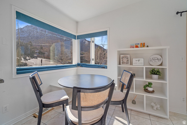 4426 South 3035 East Holladay, UT 84124 - Photo 9 of 49 Dining room featuring a mountain view and light tile patterned flooring
