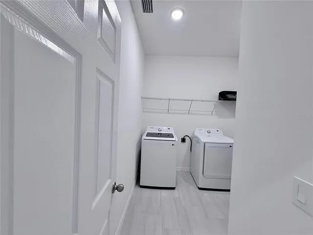 a utility room with dryer and washer