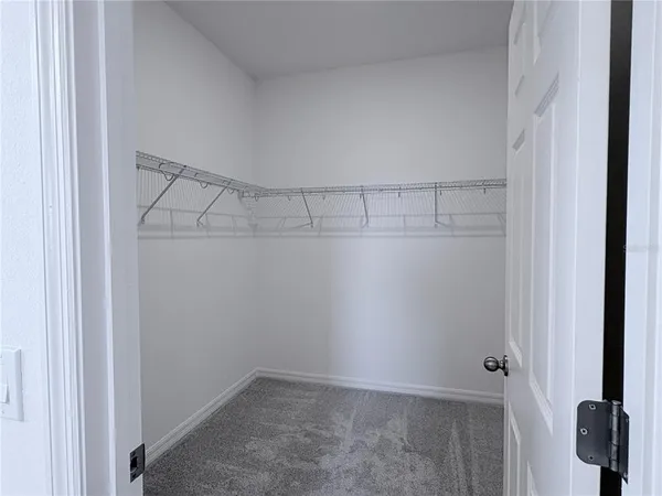 a view of a room with racks on the wall