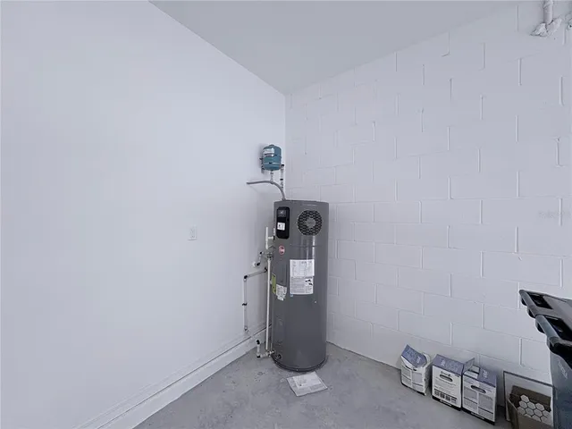 a view of storage and utility room with windows