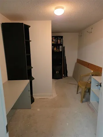 a view of room with furniture and a ceiling fan