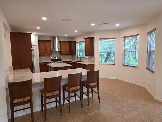 a kitchen with a table and chairs in it