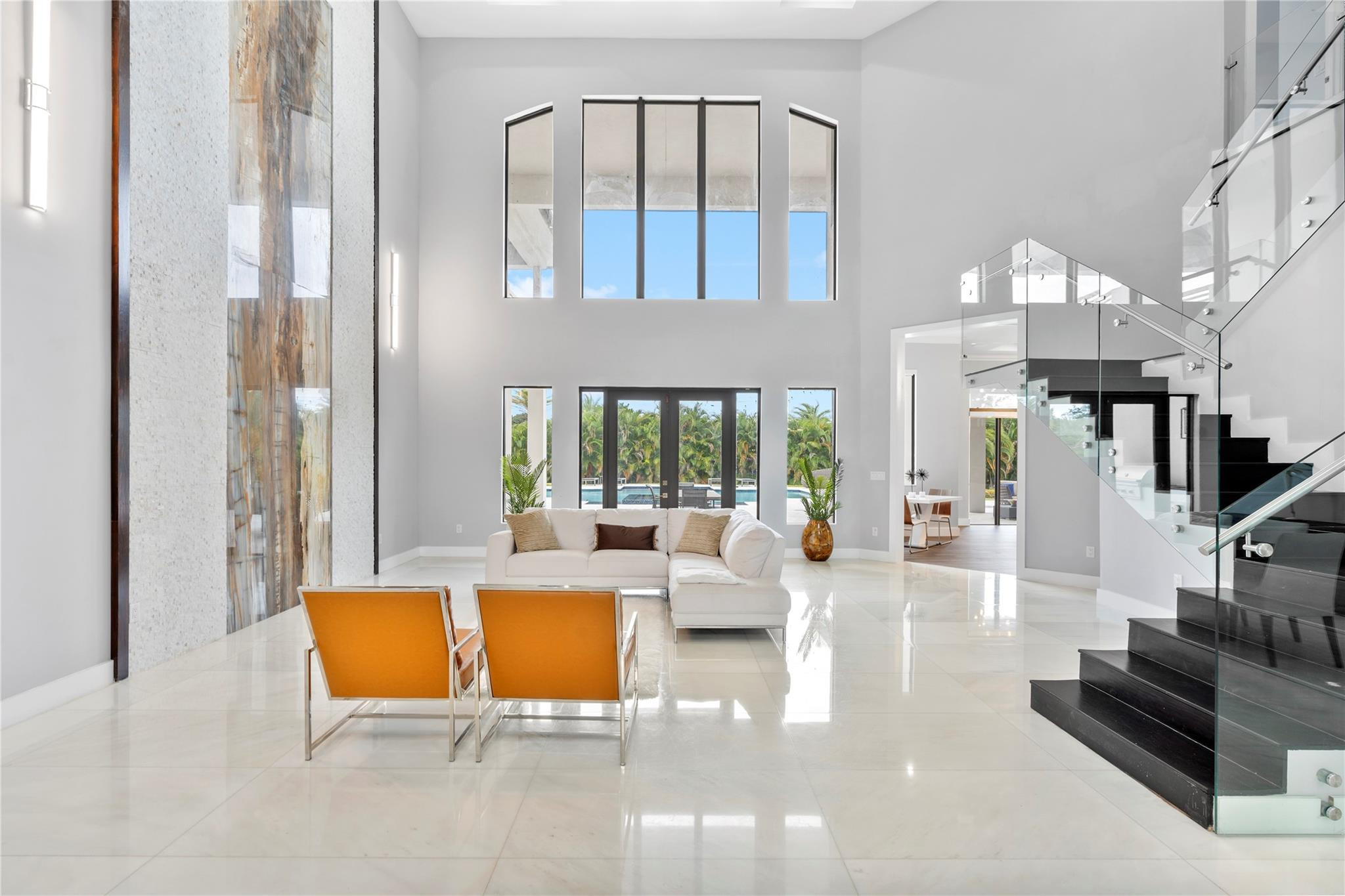 13605 Bella Ranch Lane Southwest Ranches, FL 33330 - Photo 18 of 81 a living room with furniture and a large window