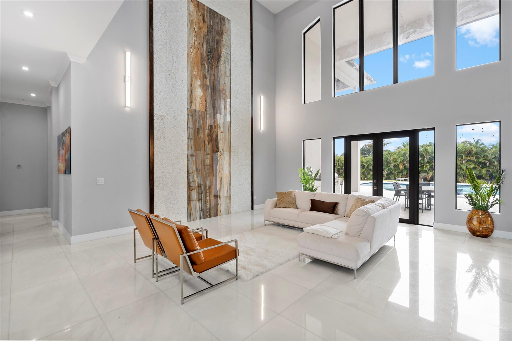 13605 Bella Ranch Lane Southwest Ranches, FL 33330 - Photo 20 of 81 a living room with furniture and a large window