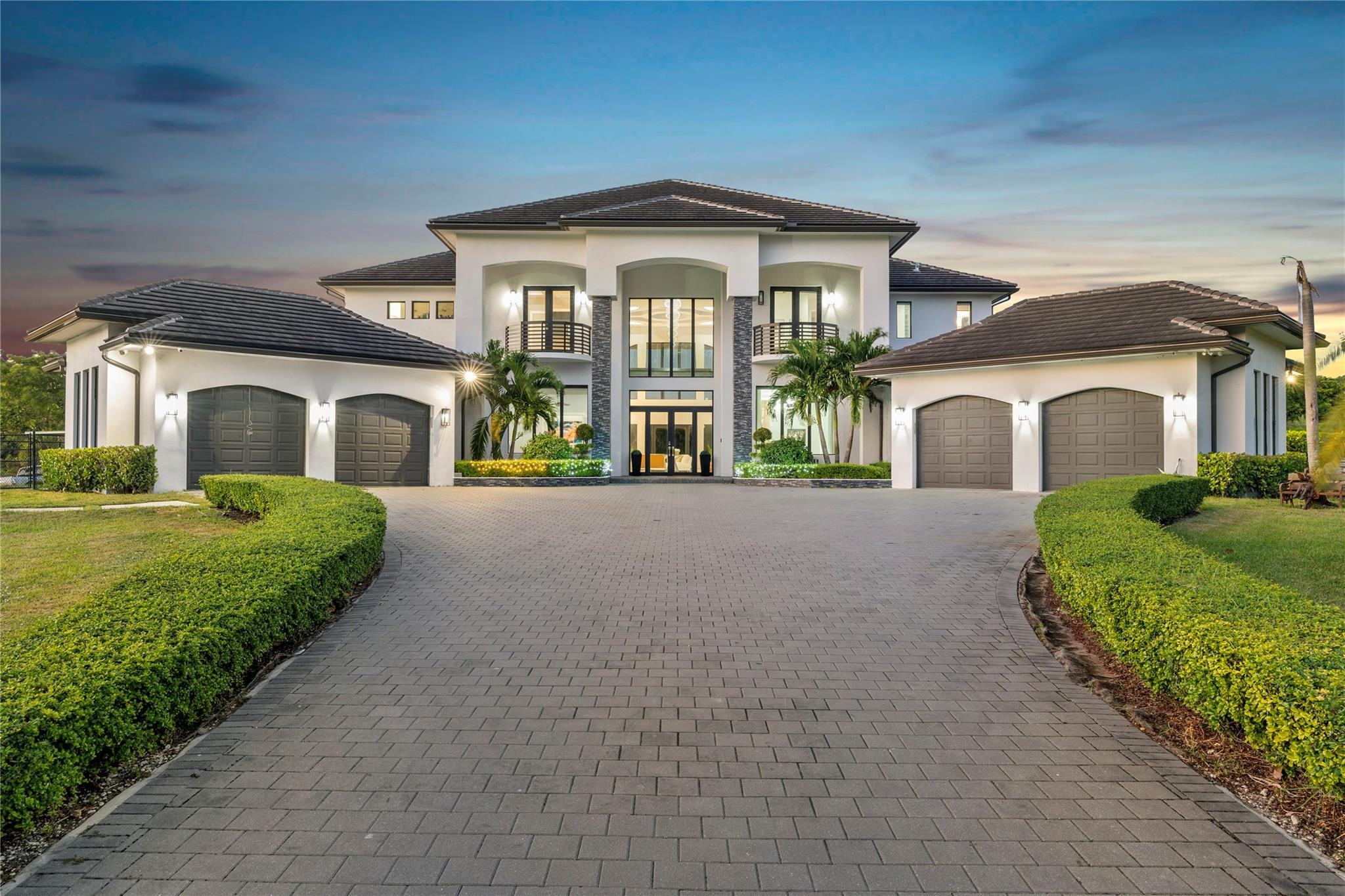13605 Bella Ranch Lane Southwest Ranches, FL 33330 - Photo 2 of 81 a front view of a house with a garden