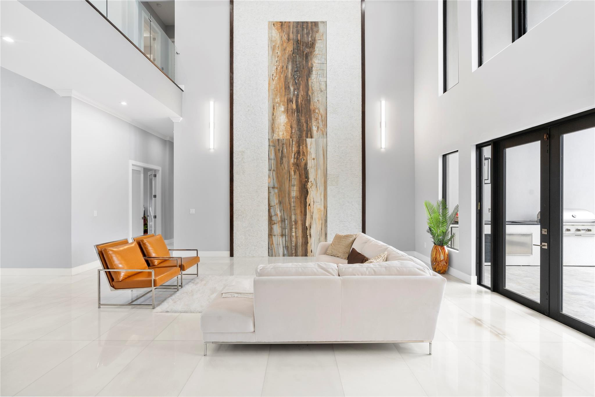 13605 Bella Ranch Lane Southwest Ranches, FL 33330 - Photo 23 of 81 a living room with furniture and large windows