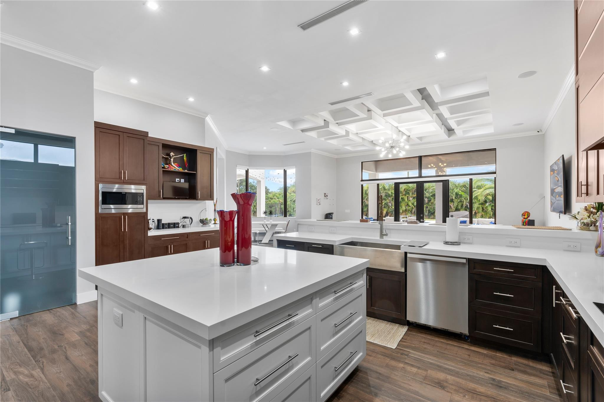 13605 Bella Ranch Lane Southwest Ranches, FL 33330 - Photo 33 of 81 a kitchen with a stove a sink and a refrigerator