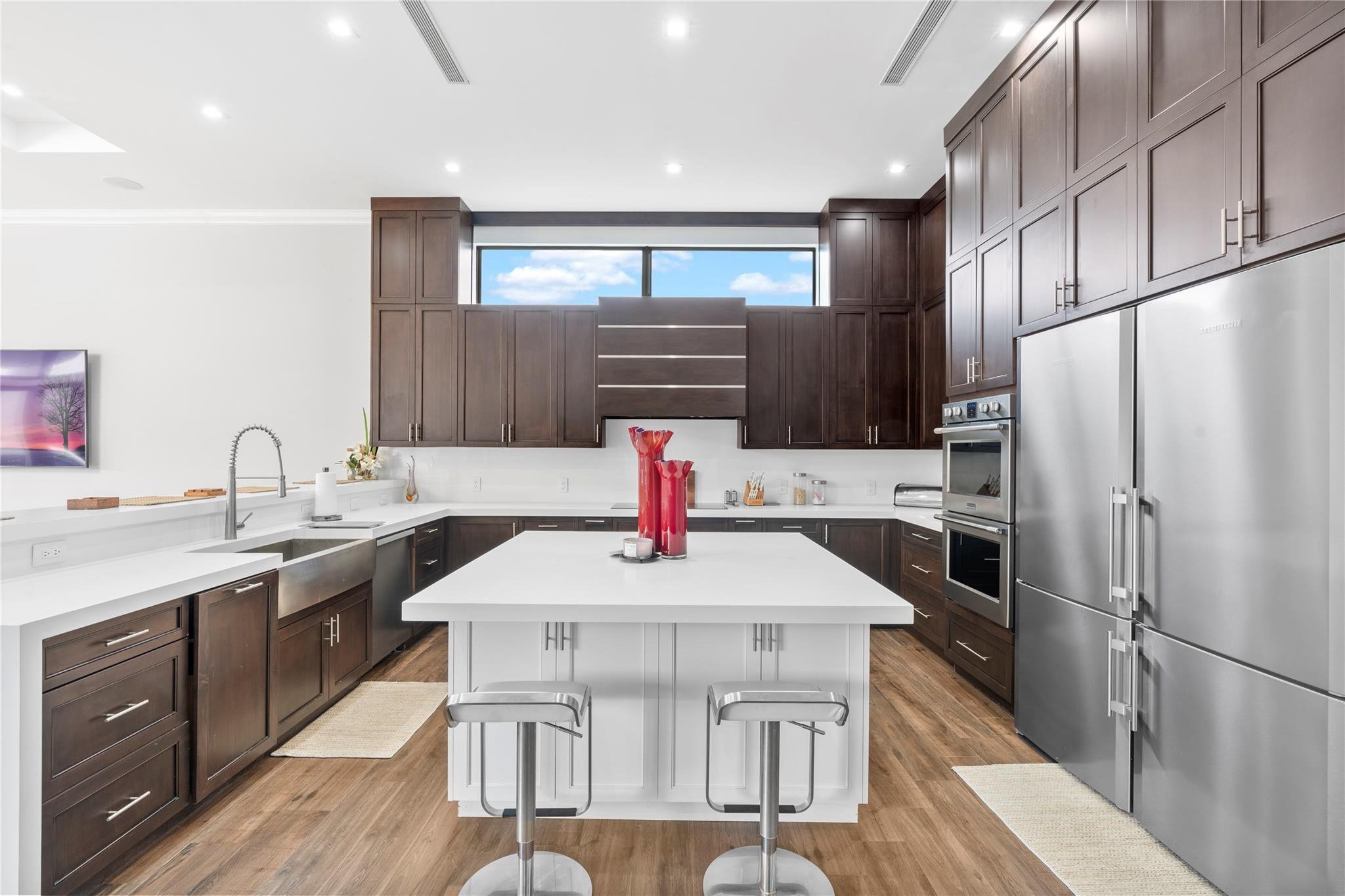 13605 Bella Ranch Lane Southwest Ranches, FL 33330 - Photo 34 of 81 a kitchen with stainless steel appliances kitchen island granite countertop a sink refrigerator and cabinets