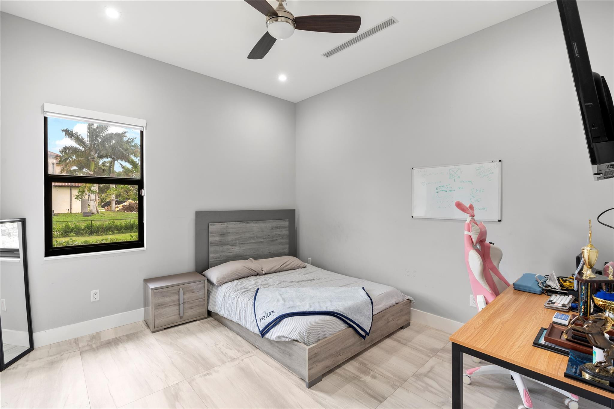 13605 Bella Ranch Lane Southwest Ranches, FL 33330 - Photo 48 of 81 a bedroom with a bed and a window