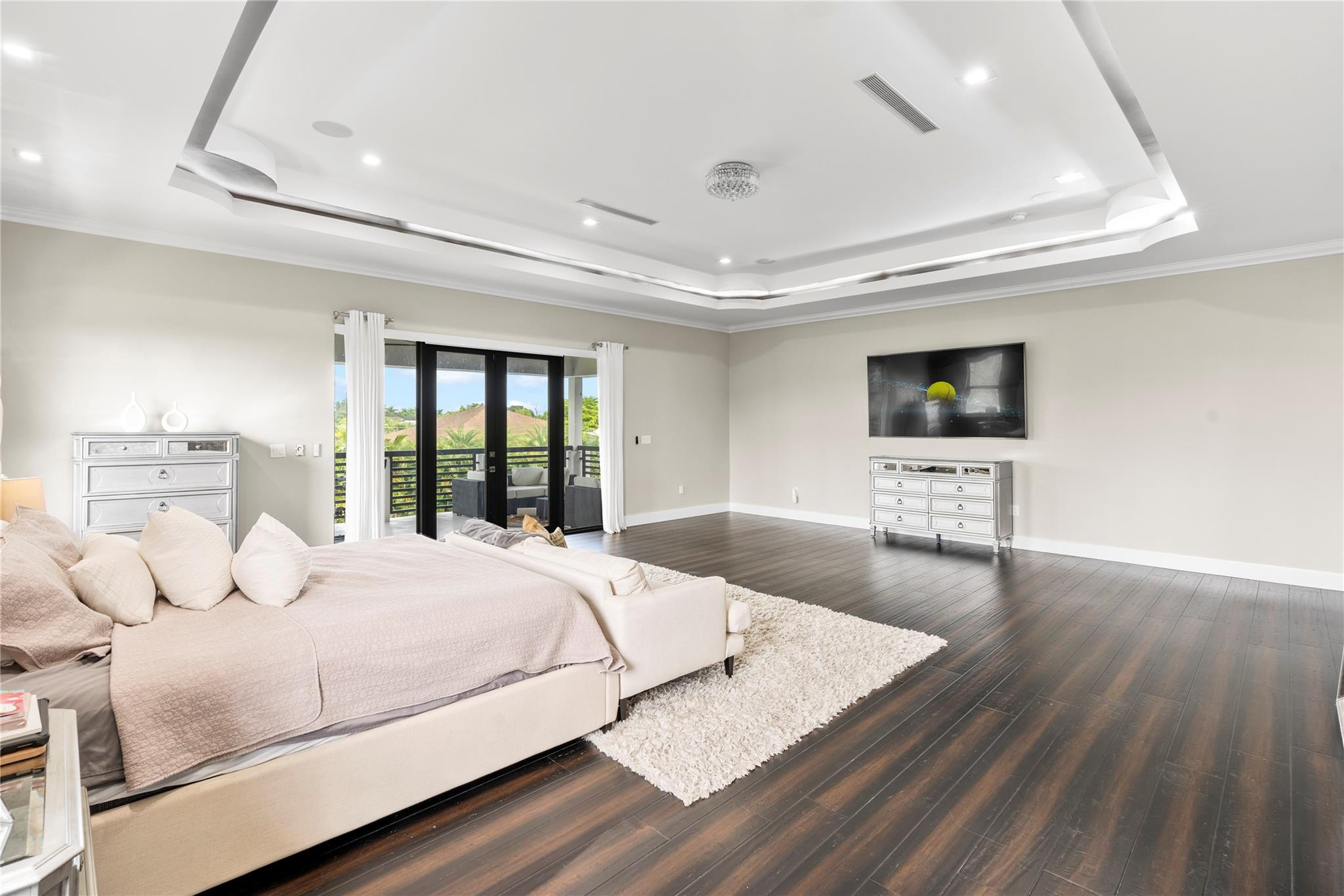 13605 Bella Ranch Lane Southwest Ranches, FL 33330 - Photo 55 of 81 a bedroom with a bed and a flat screen tv