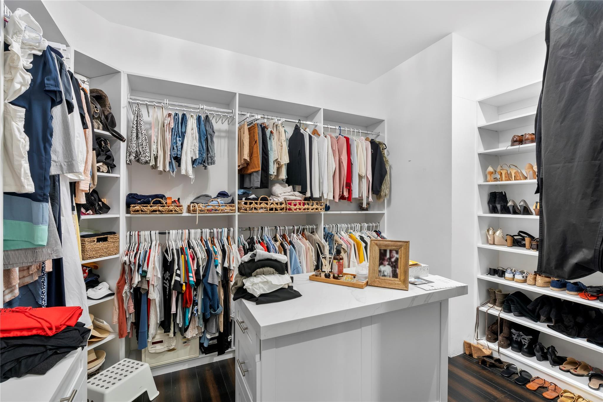 13605 Bella Ranch Lane Southwest Ranches, FL 33330 - Photo 59 of 81 a view of walk in closet with clothes and shoes