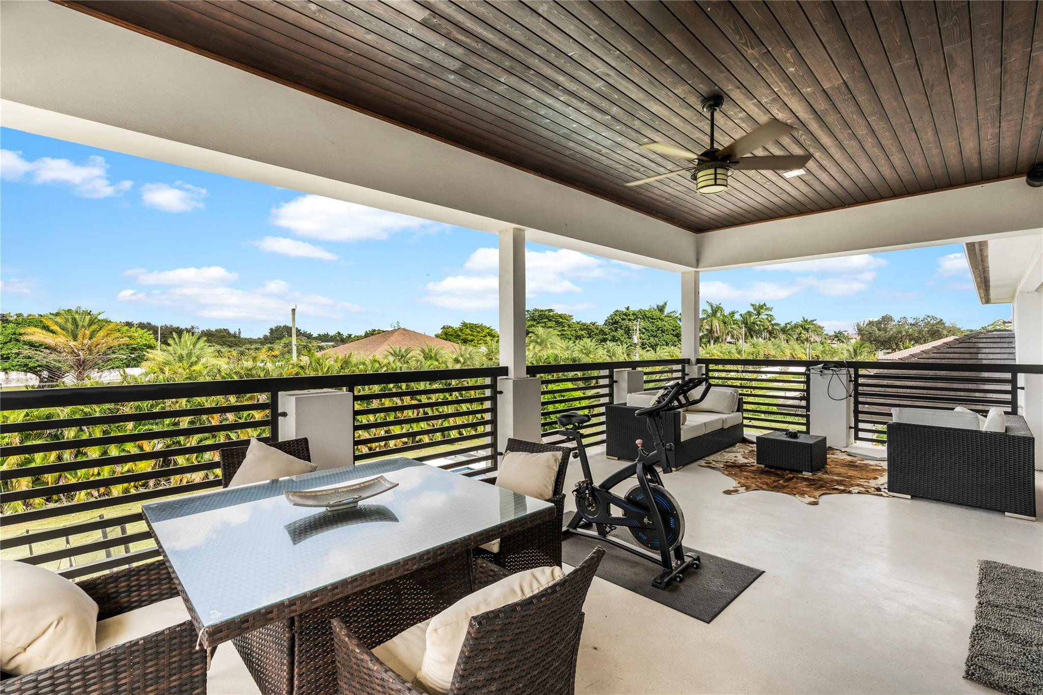13605 Bella Ranch Lane Southwest Ranches, FL 33330 - Photo 65 of 81 a view of a balcony with couple of chairs