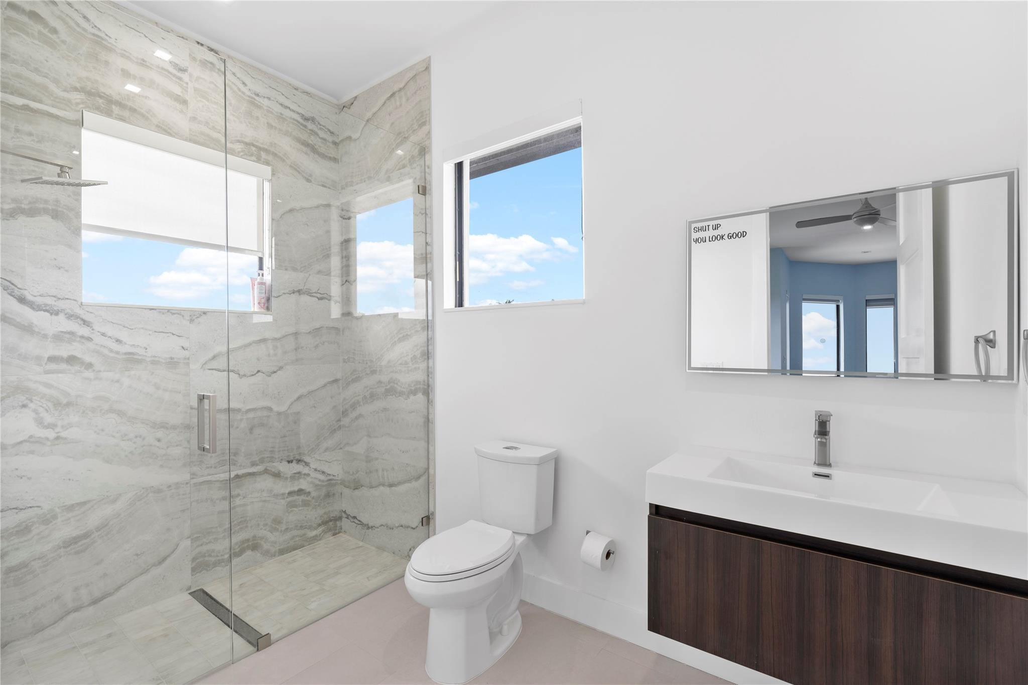 13605 Bella Ranch Lane Southwest Ranches, FL 33330 - Photo 73 of 81 a bathroom with a toilet a sink a mirror and a shower