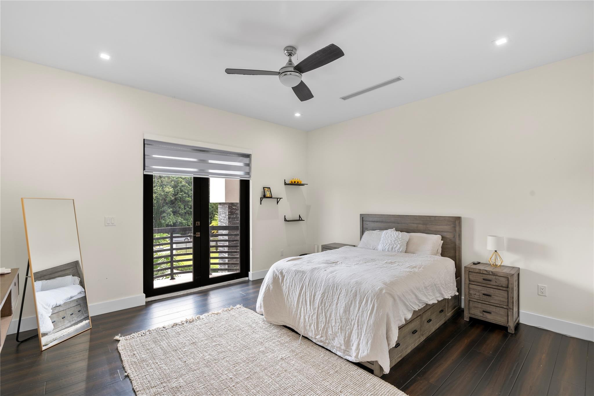 13605 Bella Ranch Lane Southwest Ranches, FL 33330 - Photo 75 of 81 a bedroom with a large bed and a ceiling fan