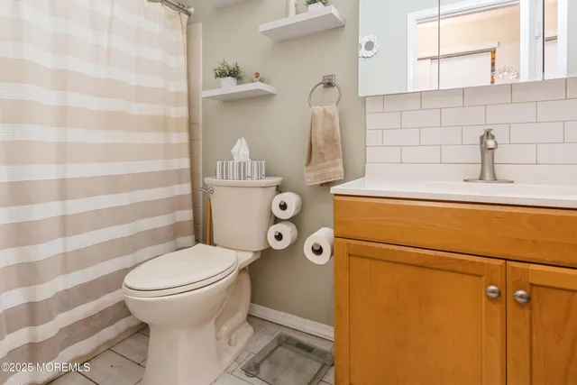 a bathroom with a toilet and a sink