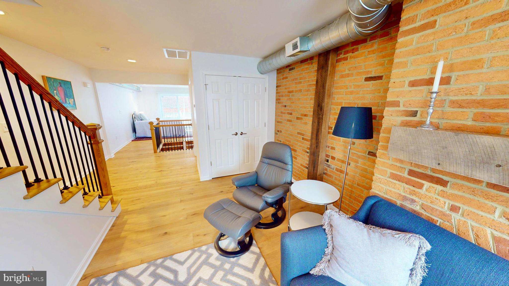 306 South Exeter Street Baltimore, MD 21202 - Photo 25 of 35 a living room with furniture and a flat screen tv
