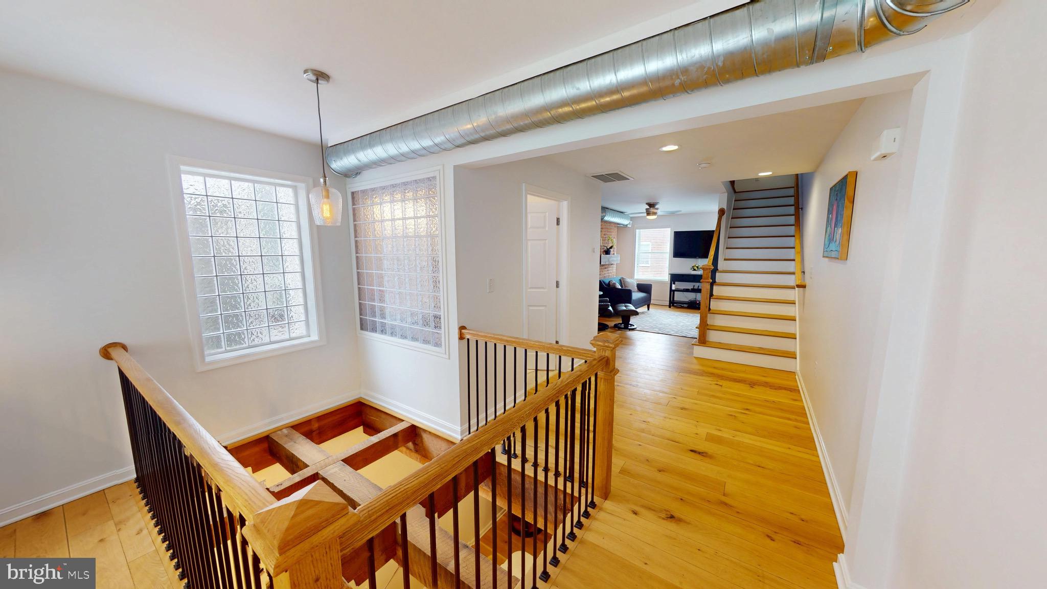 306 South Exeter Street Baltimore, MD 21202 - Photo 27 of 35 a view of a dining room with furniture and wooden floor