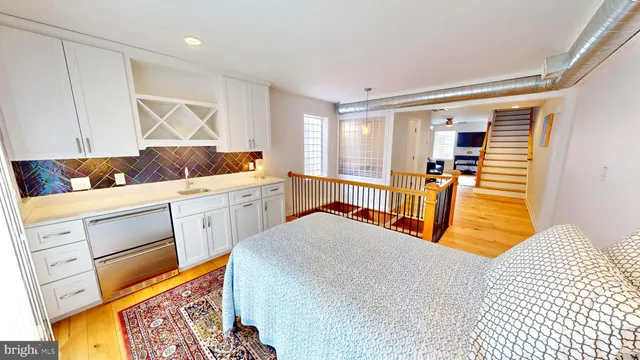 a view of a hallway and wooden floor
