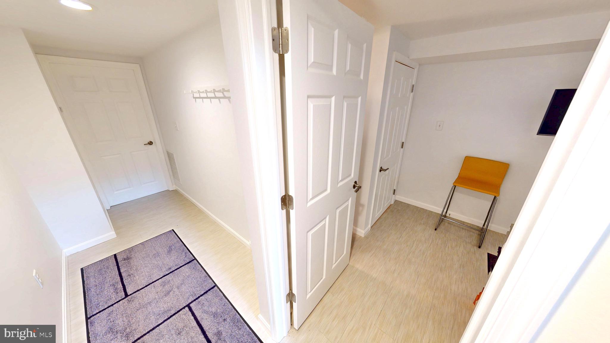 306 South Exeter Street Baltimore, MD 21202 - Photo 30 of 35 a view of a hallway and wooden floor