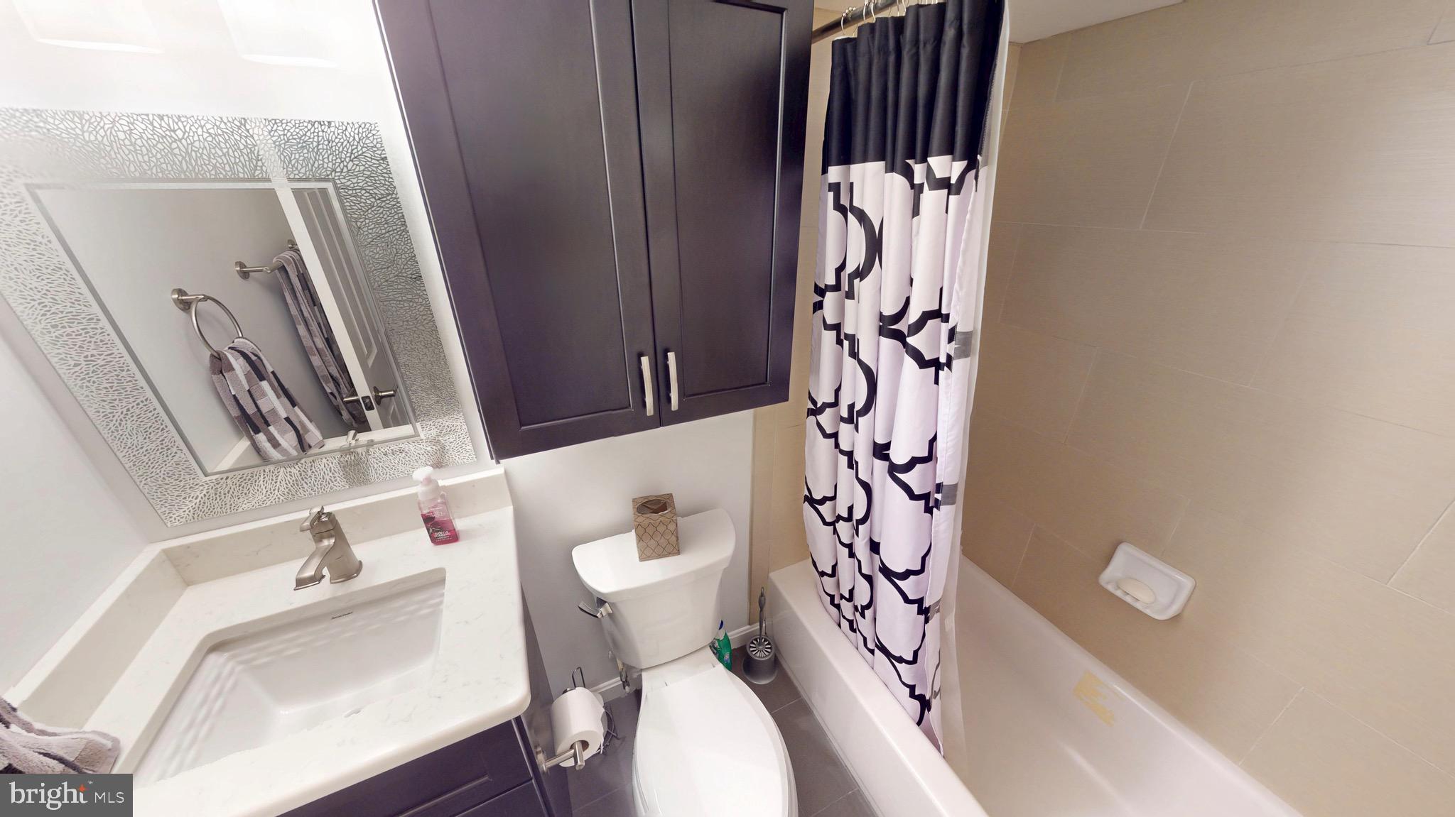 306 South Exeter Street Baltimore, MD 21202 - Photo 32 of 35 a bathroom with a sink and toilet