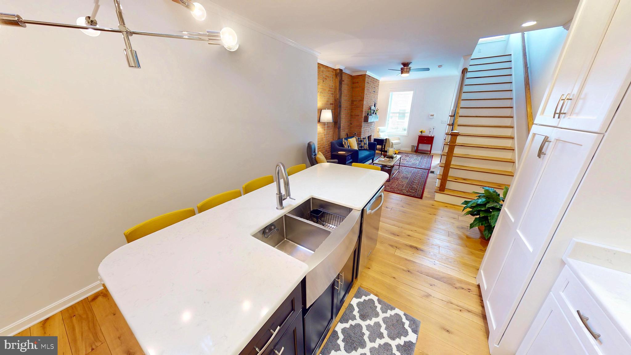 306 South Exeter Street Baltimore, MD 21202 - Photo 6 of 35 a view of living room with furniture and wooden floor