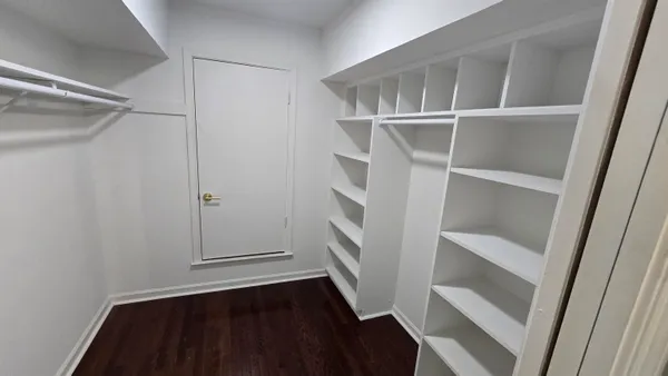 a view of an empty walk in closet
