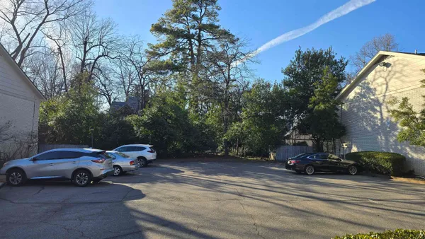 a view of street with parked cars