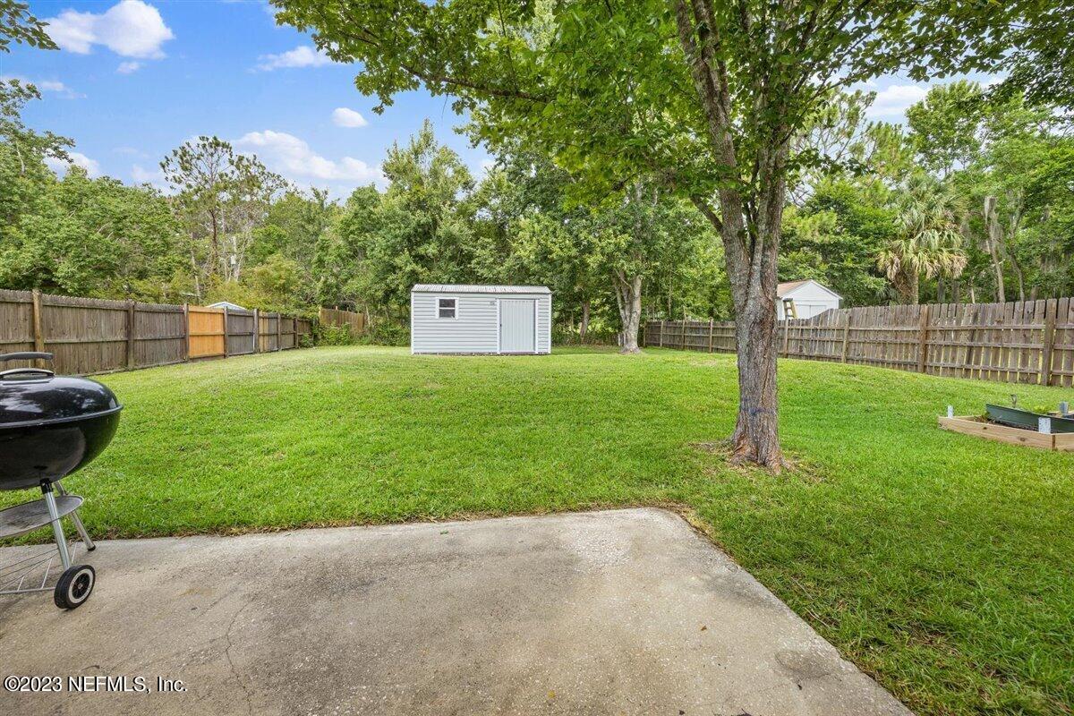 725 Alexander Street St. Augustine, FL 32084 - Photo 12 of 13 a view of a backyard with a garden