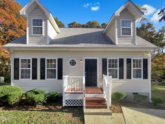 front view of a house with a small yard