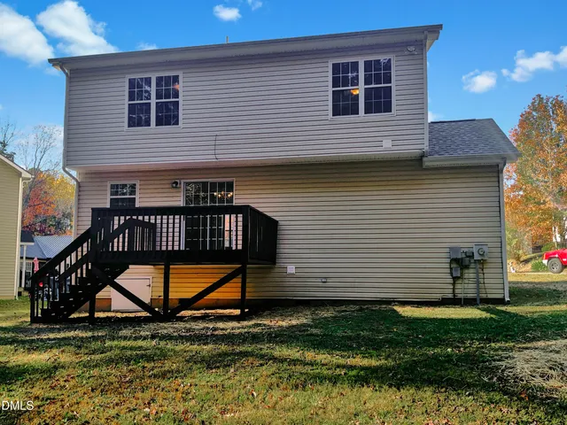 a view of backyard with a deck
