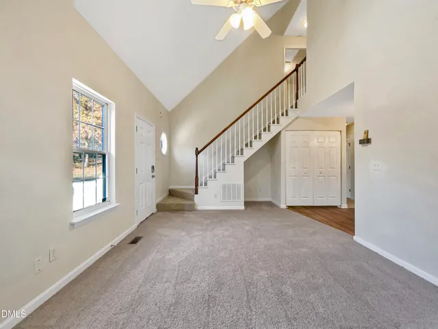 a view of an empty room with windows