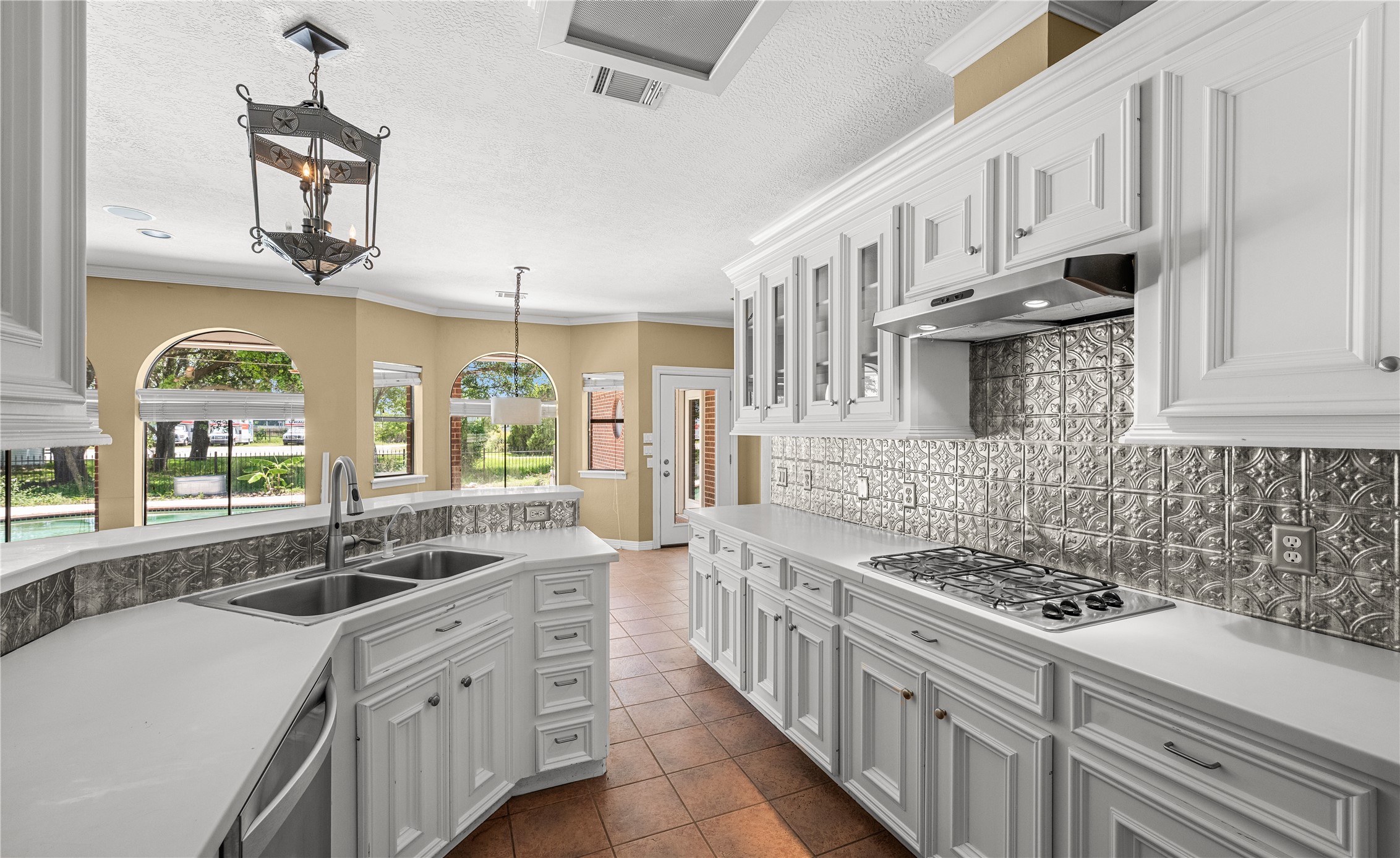 20240 Cypress Rosehill Road Tomball, TX 77377 - Photo 14 of 26 a kitchen with stainless steel appliances a sink stove and cabinets