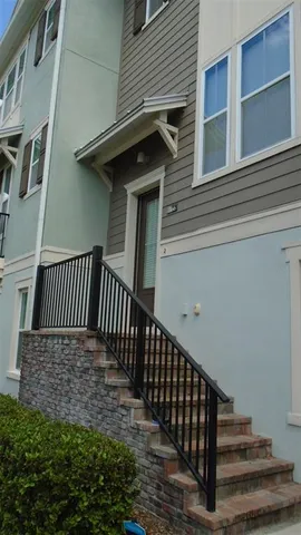 a view of a house with backyard and deck