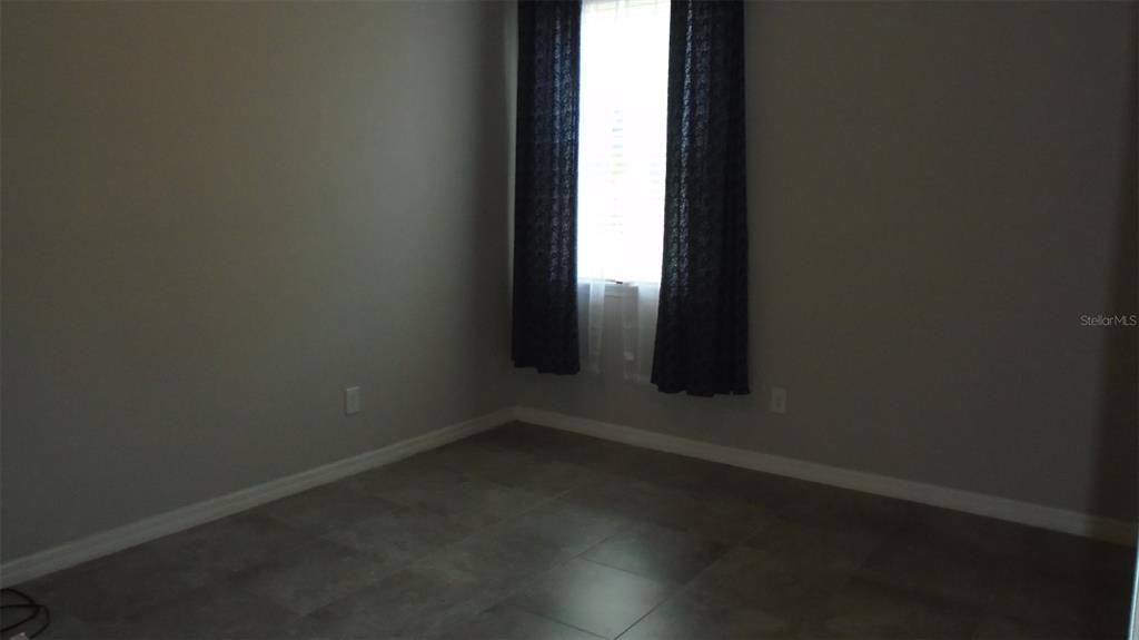 466 Windmill Palm Circle Altamonte Springs, FL 32701 - Photo 12 of 23 an empty room with a window