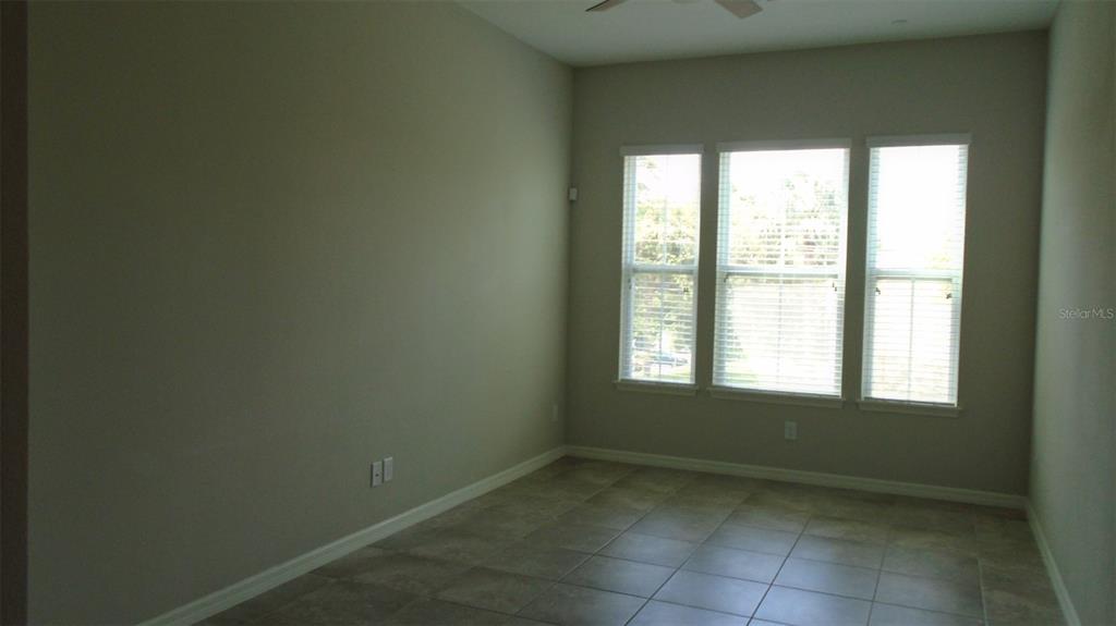 466 Windmill Palm Circle Altamonte Springs, FL 32701 - Photo 13 of 23 a view of an empty room with a window
