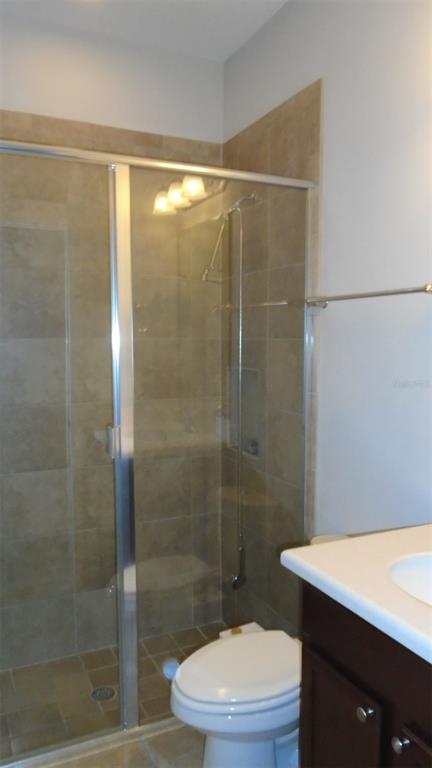 466 Windmill Palm Circle Altamonte Springs, FL 32701 - Photo 14 of 23 a bathroom with a shower a toilet and sink