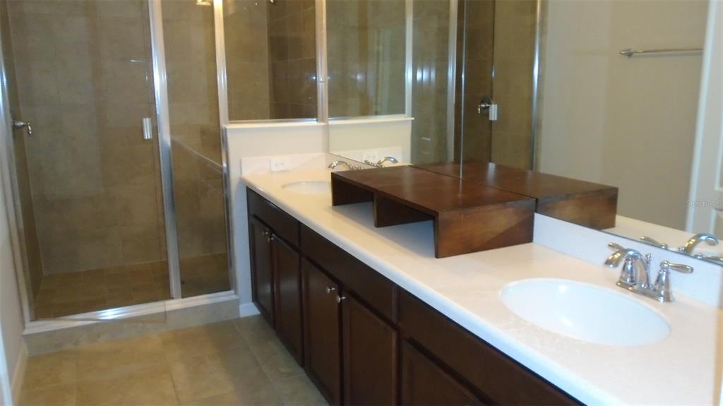 466 Windmill Palm Circle Altamonte Springs, FL 32701 - Photo 15 of 23 a bathroom with a sink and a mirror