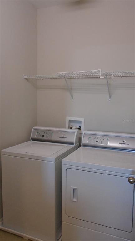 466 Windmill Palm Circle Altamonte Springs, FL 32701 - Photo 18 of 23 a utility room with dryer and washer