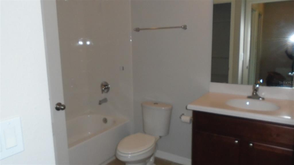 466 Windmill Palm Circle Altamonte Springs, FL 32701 - Photo 10 of 23 a bathroom with a sink a toilet and shower