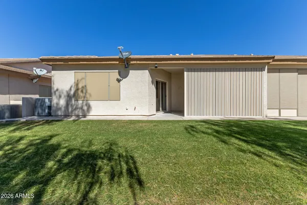 a view of a back yard of the house