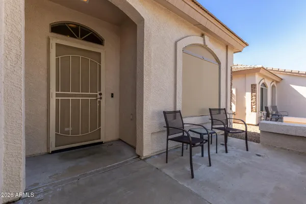 a view of a livingroom with furniture and front door