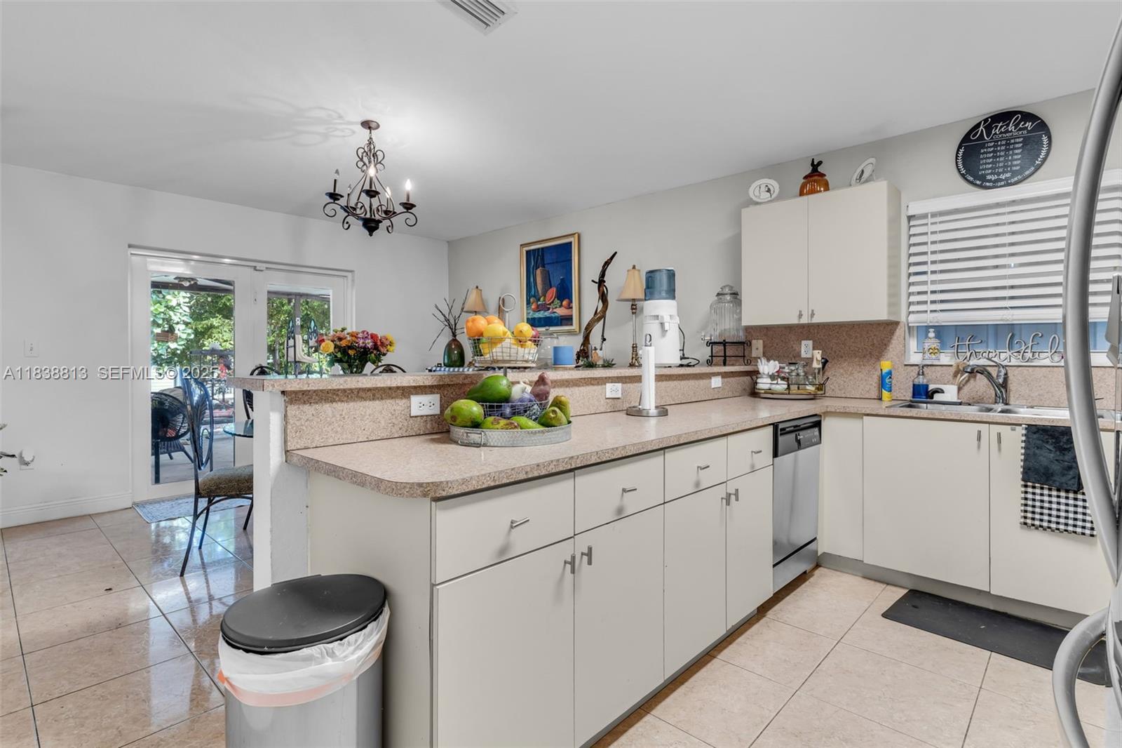 25237 Southwest 133rd Place Homestead, FL 33032 - Photo 17 of 39 a kitchen with a sink cabinets and window