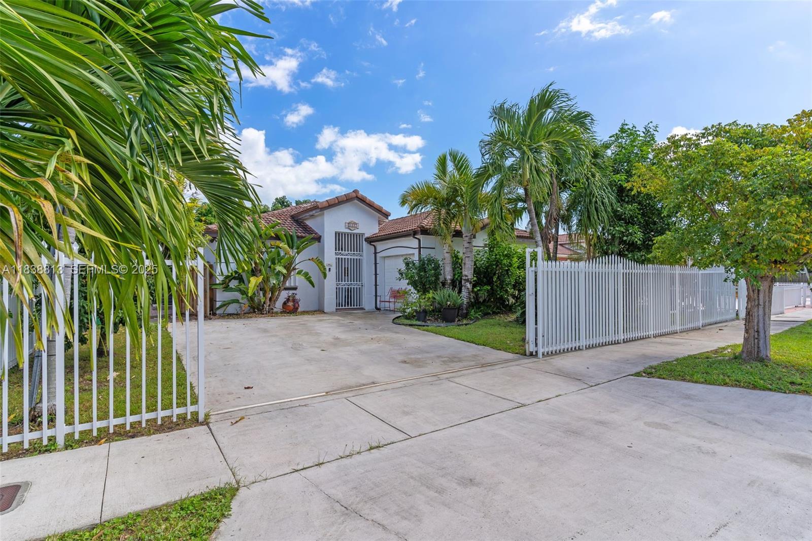 25237 Southwest 133rd Place Homestead, FL 33032 - Photo 2 of 39 a view of a entrance gate of a house