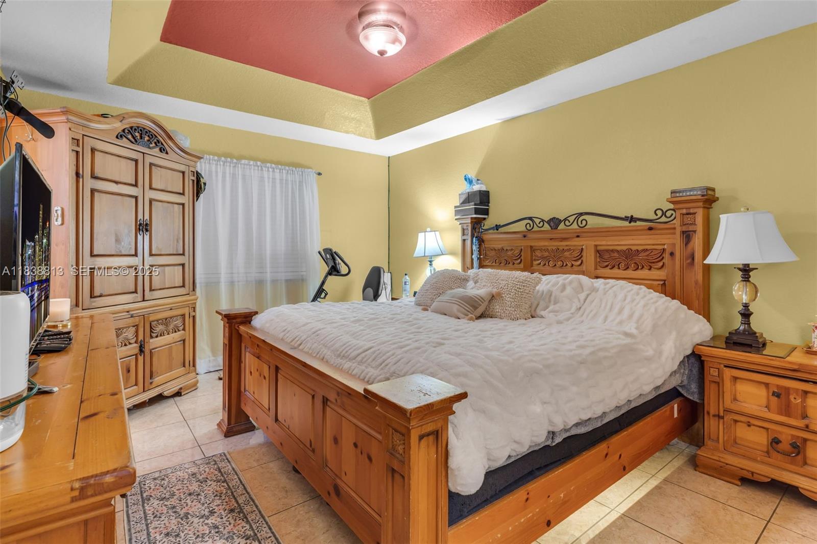 25237 Southwest 133rd Place Homestead, FL 33032 - Photo 21 of 39 a bed room with a bed and a dresser